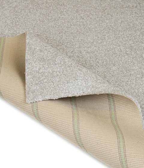 Cream carpet, corner turned back to show the backing