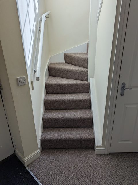 Winding staircase carpet fitted by LG Flooring
