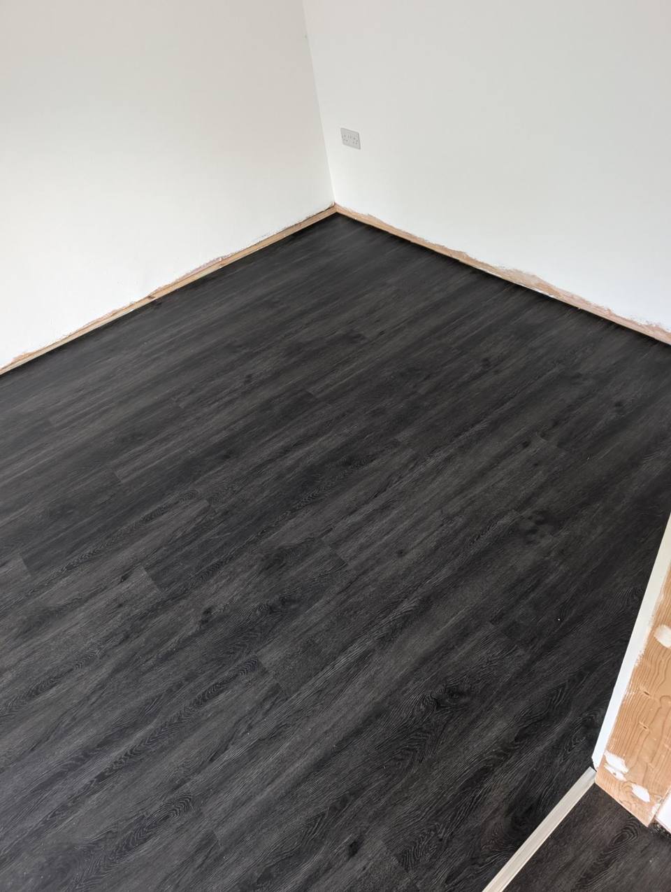 Finished dark grey oak-effect LVT floor