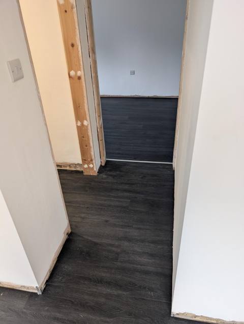 LVT running through doorways into the next room