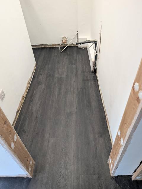 Hallway with dark grey plank flooring