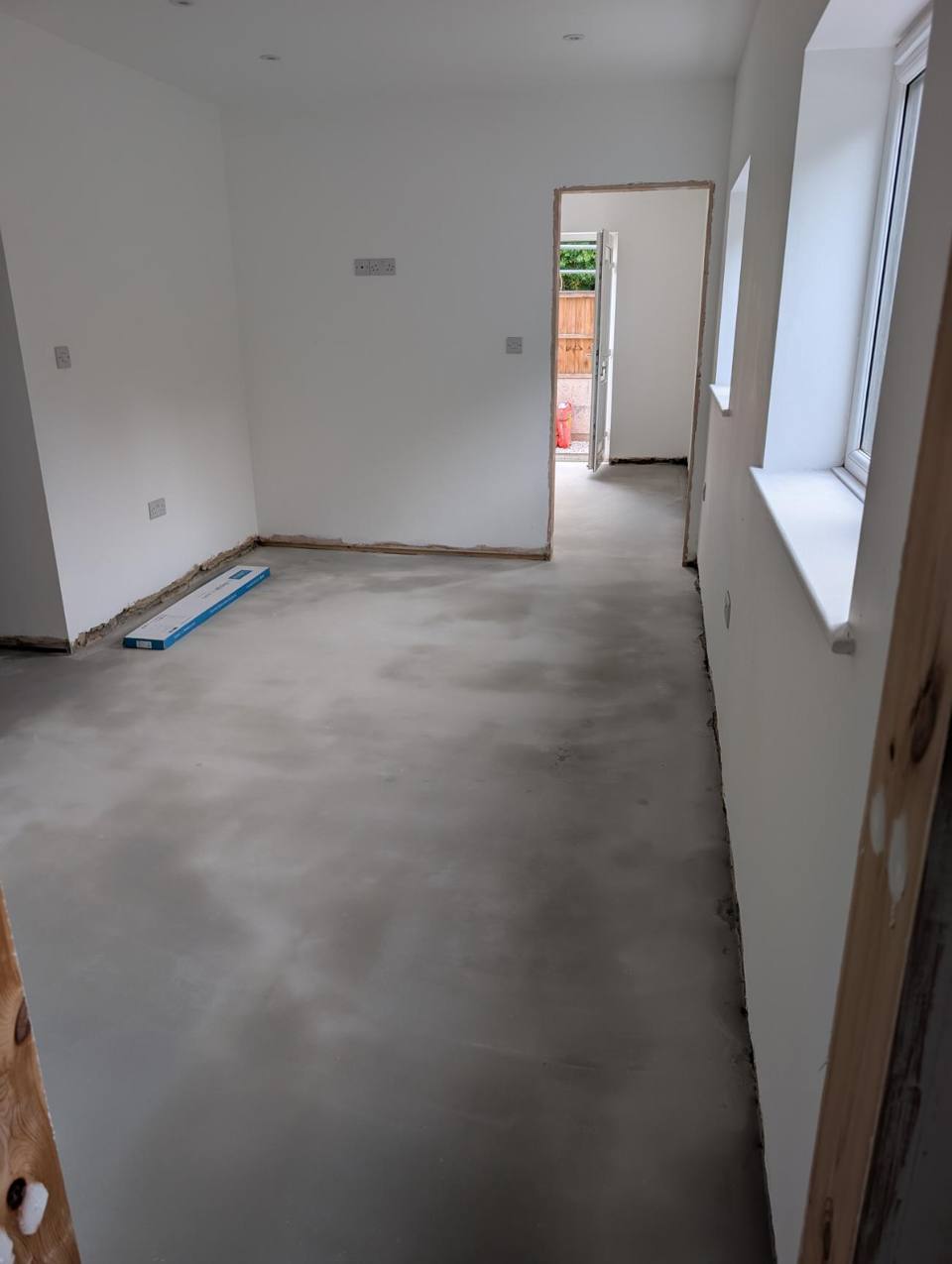 Bare concrete subfloor before preparation