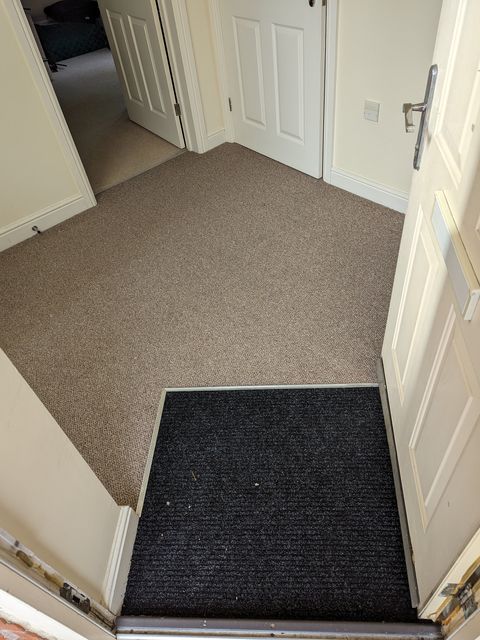 Carpet with inset entrance matting