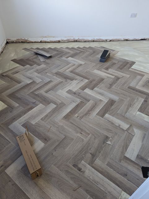 Herringbone LVT mid-fit, laid on the prepared floor