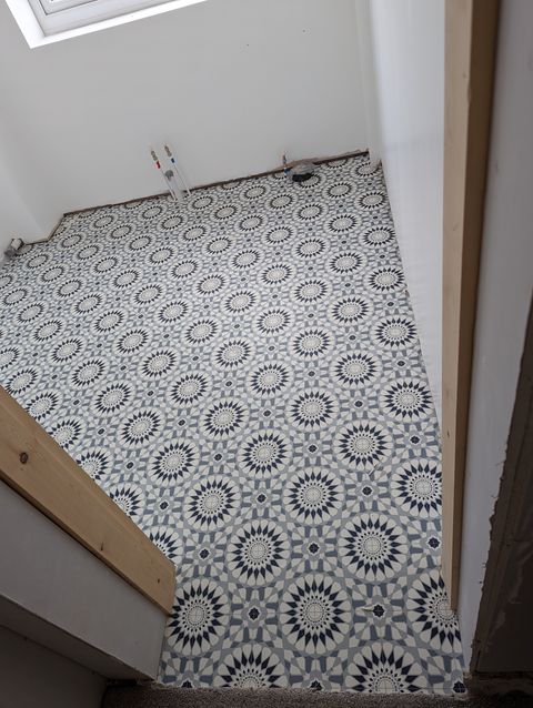 Bold blue geometric vinyl in a new bathroom