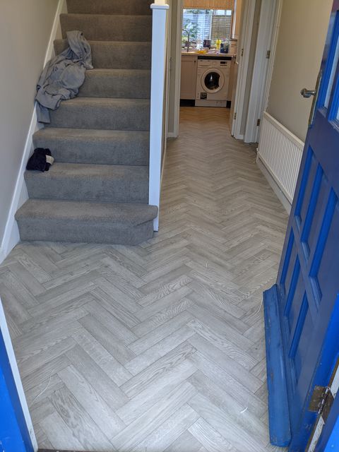 Grey herringbone-effect vinyl, hall into kitchen