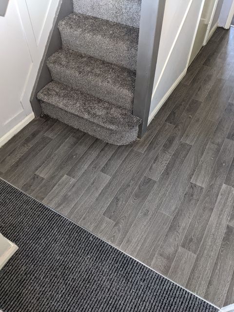 Entrance matting at the foot of the stairs