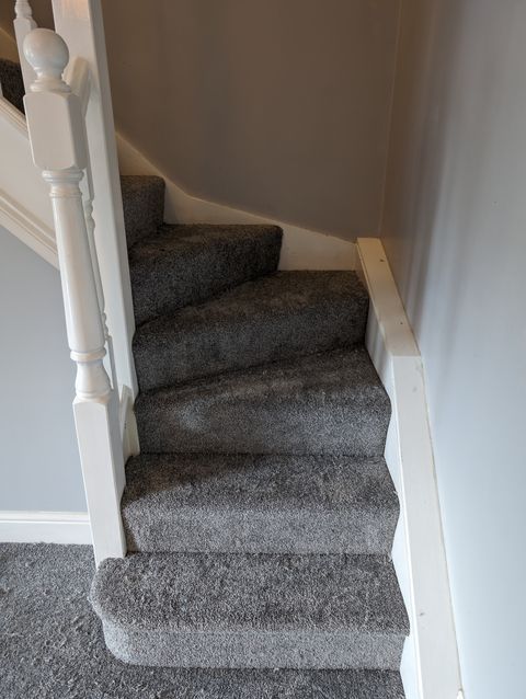 Grey carpet on winder stairs