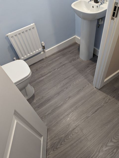 Straight plank grey LVT, cloakroom