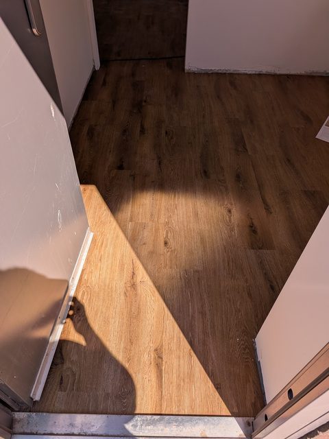 Coming in through the door to an office fitted in glue-down LVT by LG Flooring