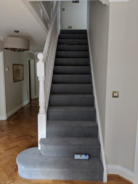 Finished stairs with a bullnose bottom step